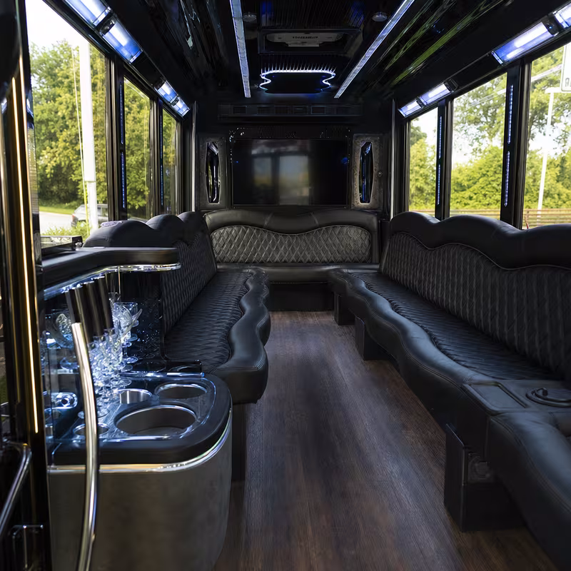 Friends laughing during a Lincoln party bus celebration