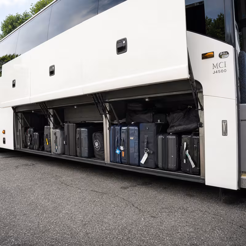 Party bus interior with wraparound leather seating and LED lighting in Lincoln