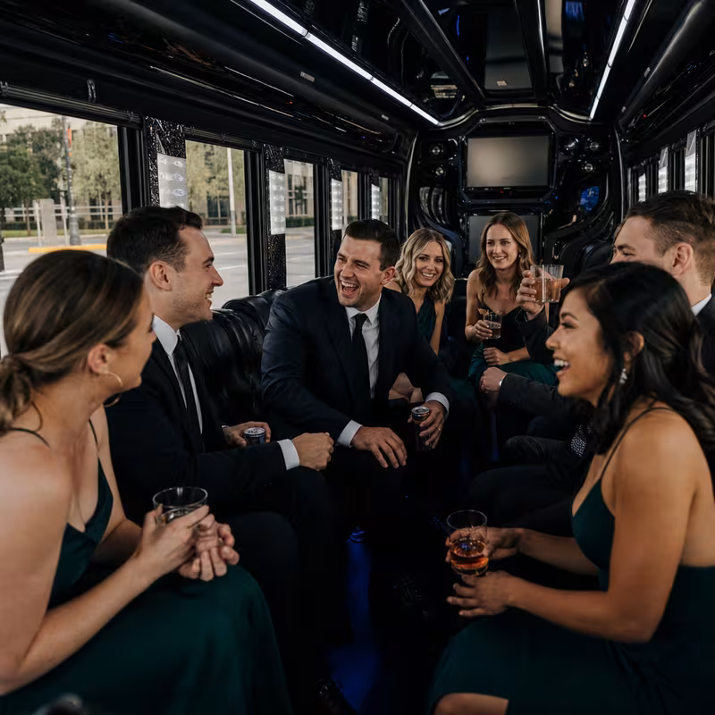 Party bus interior with wraparound leather seating and LED lighting in Lincoln