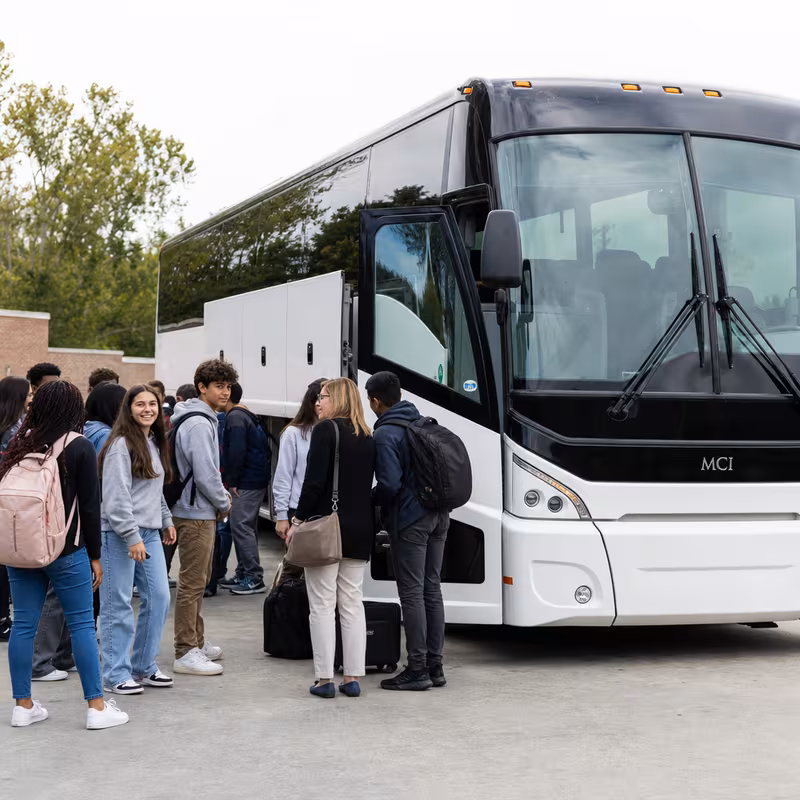 Black Mercedes Sprinter van staged for an Lincoln School Transportation group