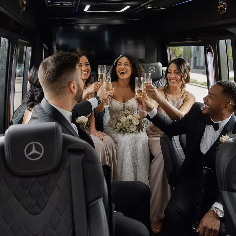 Black Mercedes Sprinter van staged for an Lincoln Wedding Transportation group