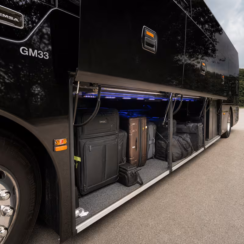 Party bus interior with wraparound leather seating and LED lighting in Lincoln
