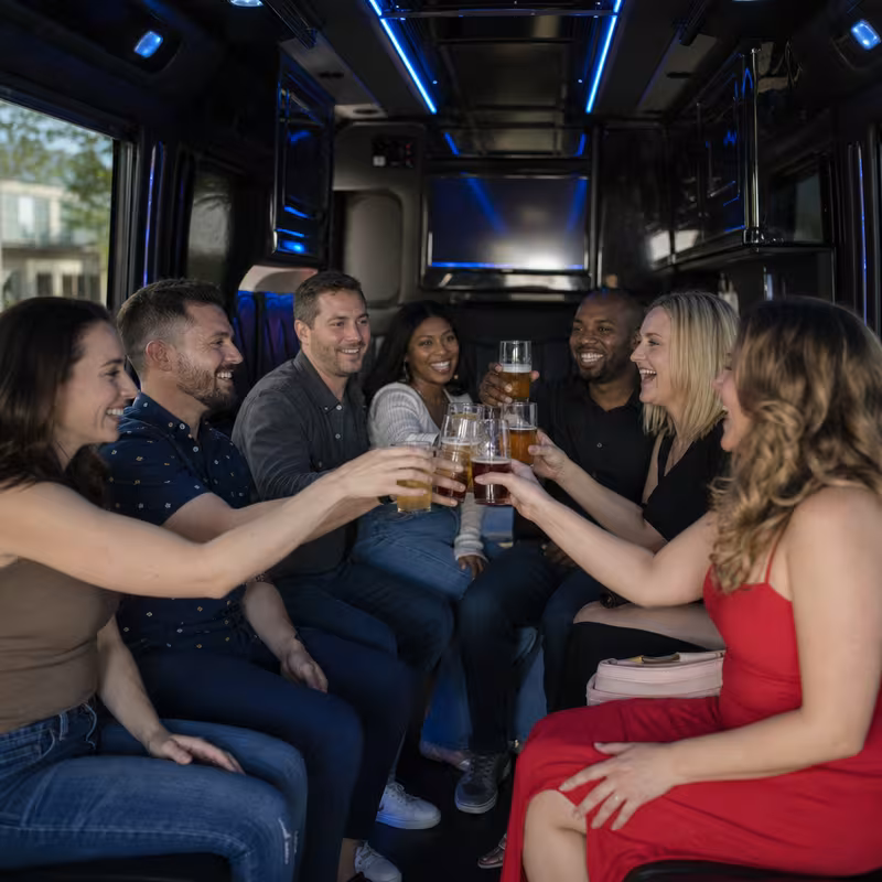 Group boarding a white charter bus for Winery & Brewery Tour Transportation transportation in Lincoln